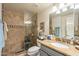 Elegant bathroom with a walk-in shower, granite countertop, and modern fixtures at 2369 W Shawnee Dr, Chandler, AZ 85224