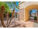 Cozy gated courtyard with terra cotta tile, mature palms, and secure entry to home at 2369 W Shawnee Dr, Chandler, AZ 85224