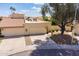 Charming single-Gathering home featuring a three-car garage, a front yard, and a terracotta tile roof at 2369 W Shawnee Dr, Chandler, AZ 85224