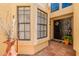 Welcoming front entry featuring a dark front door, tile walkway, and decorative plants at 2369 W Shawnee Dr, Chandler, AZ 85224
