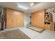 Spacious two car garage with ample storage cabinets and shelving on both sides of the interior at 2369 W Shawnee Dr, Chandler, AZ 85224