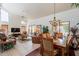 Spacious living room with vaulted ceilings, tile floors, fireplace, and a view to the backyard at 2369 W Shawnee Dr, Chandler, AZ 85224