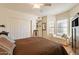 Cozy bedroom with a ceiling fan, a bed bench by a window, and a closet at 2369 W Shawnee Dr, Chandler, AZ 85224