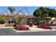 Beautiful clubhouse entrance with well-kept landscaping and colorful flower arrangements at 2633 S El Dorado Dr, Mesa, AZ 85202