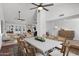 Elegant dining area with a long table, leading to the living room and backyard at 2633 S El Dorado Dr, Mesa, AZ 85202
