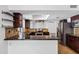 Kitchen featuring dark wood cabinets, granite countertops, and stainless steel appliances at 2633 S El Dorado Dr, Mesa, AZ 85202