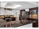 Well-equipped kitchen with dark cabinetry, stainless steel appliances, and skylight at 2633 S El Dorado Dr, Mesa, AZ 85202