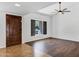 Bright living room featuring a large window and modern ceiling fan at 2633 S El Dorado Dr, Mesa, AZ 85202