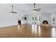 Bright, open living room featuring a fireplace, tile floors, and access to the pool area at 2633 S El Dorado Dr, Mesa, AZ 85202