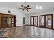 A bright room featuring multiple windows, tile flooring and wood framed doors at 2633 S El Dorado Dr, Mesa, AZ 85202