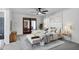 Staged bedroom featuring a ceiling fan, access to the outside, and art at 2633 S El Dorado Dr, Mesa, AZ 85202