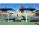 Active pickleball courts with players and shaded seating areas in a vibrant community setting at 2633 S El Dorado Dr, Mesa, AZ 85202