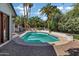 Backyard pool area surrounded by mature landscaping and a brick patio perfect for entertaining at 2633 S El Dorado Dr, Mesa, AZ 85202
