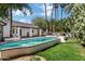Inviting backyard pool area with lush landscaping and tall palm trees surrounding the property at 2633 S El Dorado Dr, Mesa, AZ 85202
