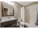 Cozy bathroom features a shower-tub combo and a vanity with storage space at 26814 N 65Th Dr, Phoenix, AZ 85083