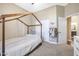Spacious bedroom with a decorative bed frame, closet, and carpet flooring at 26814 N 65Th Dr, Phoenix, AZ 85083