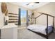 Bright bedroom featuring decorative shelving, natural light, and carpeted floors at 26814 N 65Th Dr, Phoenix, AZ 85083