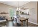 Cozy dining room featuring a wooden table and a view into the kitchen at 26814 N 65Th Dr, Phoenix, AZ 85083