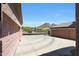 View of the long driveway and desert landscape from the front of the home at 26814 N 65Th Dr, Phoenix, AZ 85083