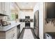 Modern kitchen featuring white cabinets, stainless steel appliances and plenty of light at 26814 N 65Th Dr, Phoenix, AZ 85083