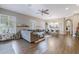 Bright and airy living room with open layout, modern furniture, and wood flooring at 26814 N 65Th Dr, Phoenix, AZ 85083