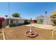 Backyard featuring a charming white and green house with lamp post, perfect for enjoying outdoor living at 2926 W San Miguel Ave, Phoenix, AZ 85017