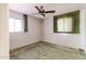 Bedroom features a window for natural light and a ceiling fan at 2926 W San Miguel Ave, Phoenix, AZ 85017