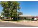 Charming single-story home with a spacious front yard and mature tree providing shade at 2926 W San Miguel Ave, Phoenix, AZ 85017