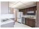 Functional kitchen with white countertops and dated cabinetry, a blank canvas ready for modern updates at 2926 W San Miguel Ave, Phoenix, AZ 85017