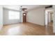 Inviting living room with hardwood floors and a front door, filled with natural light from a large window at 2926 W San Miguel Ave, Phoenix, AZ 85017