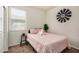 Comfortable bedroom with plush bedding, stylish decor, and bright natural light from the window at 30238 N Ocotillo Dr, Florence, AZ 85132
