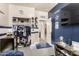 Sports-themed bedroom with a walk-in closet, wall-mounted TV, and sports decor at 30238 N Ocotillo Dr, Florence, AZ 85132