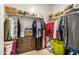 Organized walk-in closet featuring ample hanging space, shelving, and storage drawers at 30238 N Ocotillo Dr, Florence, AZ 85132