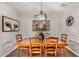 Nicely decorated dining room featuring wood floors and an eye-catching light fixture at 30238 N Ocotillo Dr, Florence, AZ 85132