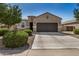Charming single-story home featuring a two-car garage and manicured landscaping at 30238 N Ocotillo Dr, Florence, AZ 85132