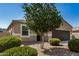 Charming single-story home featuring a two-car garage and manicured landscaping at 30238 N Ocotillo Dr, Florence, AZ 85132