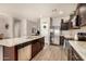 Spacious kitchen featuring a kitchen island, stainless steel appliances, and modern cabinetry at 30238 N Ocotillo Dr, Florence, AZ 85132
