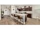 Well-equipped kitchen featuring an island with bar seating, stainless steel appliances, and ample counter space at 30238 N Ocotillo Dr, Florence, AZ 85132