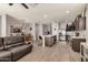 Open-concept living and kitchen area with stainless steel appliances and a center island at 30238 N Ocotillo Dr, Florence, AZ 85132