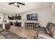 Open concept living room with a kitchen view, showcasing modern furniture and a spacious layout at 30238 N Ocotillo Dr, Florence, AZ 85132