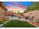 Large backyard showcasing a swimming pool, landscaped area, and outdoor seating area at 3295 S Ambrosia Dr, Chandler, AZ 85248
