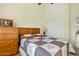 Comfortable bedroom features neutral tones, a wood dresser, and soft carpeting at 3295 S Ambrosia Dr, Chandler, AZ 85248