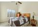 Cozy bedroom with natural light, neutral colors, and a comfortable quilted bedspread at 3295 S Ambrosia Dr, Chandler, AZ 85248