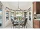 Charming dining area with a glass table, decorative chairs, and view of the pool at 3295 S Ambrosia Dr, Chandler, AZ 85248