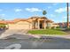 Charming single-story home featuring a three-car garage, desert landscaping, and a tile roof at 3295 S Ambrosia Dr, Chandler, AZ 85248