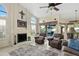 Sunlit living room with vaulted ceiling, fireplace, and comfortable seating, perfect for relaxing and entertaining guests at 3295 S Ambrosia Dr, Chandler, AZ 85248
