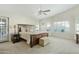 Spacious main bedroom featuring an expansive bed, large windows, and an ensuite bathroom at 3295 S Ambrosia Dr, Chandler, AZ 85248