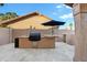 Cozy outdoor kitchen features a built-in BBQ, providing an ideal space for entertaining in the backyard at 3295 S Ambrosia Dr, Chandler, AZ 85248