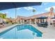 Beautiful pool with travertine patio, and luxurious outdoor living, perfect for Gathering fun and entertaining at 3295 S Ambrosia Dr, Chandler, AZ 85248