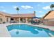 Clean swimming pool features travertine patio, with outdoor living spaces, perfect for outdoor dining and relaxation at 3295 S Ambrosia Dr, Chandler, AZ 85248